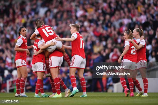 Jennifer Beattie of Arsenal is congratulated by teammates Rafaelle Souza, Laura Wienroither, Katie McCabe and Lina Hurtig after scoring her team's...