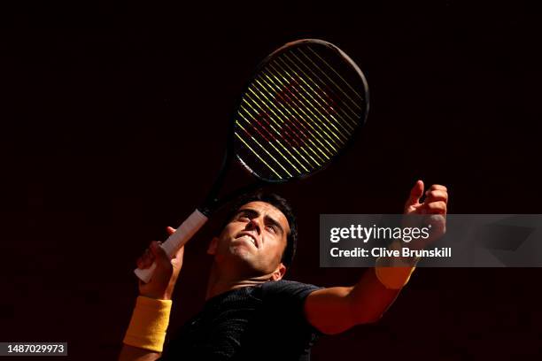 Jaume Munar of Spain serves against Daniel Altmaier of Germany during the Men's Singles Fourth Round match on Day Nine of the Mutua Madrid Open at La...