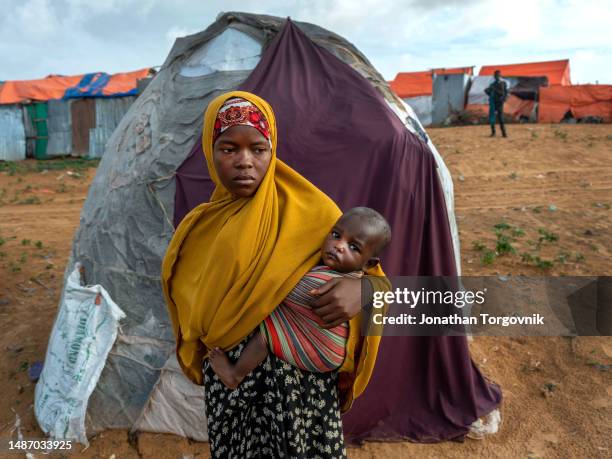 Families, mainly women and children at Kahda IDP camp near Mogadishu. Most young kids arrive with severe malnutrition, and some die. June 20, 2022 in...