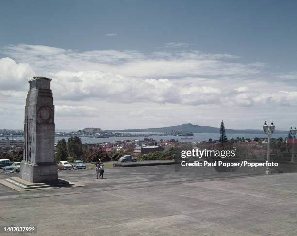 Pedestrians walk past the cenotaph outside Auckland War Memorial Museum on Observatory Hill in the centre of the city of Auckland on the North Island...