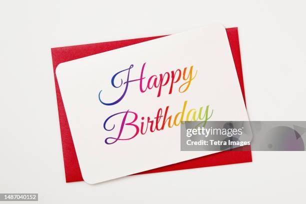 colorful happy birthday card on red envelope - postal-de-parabéns imagens e fotografias de stock