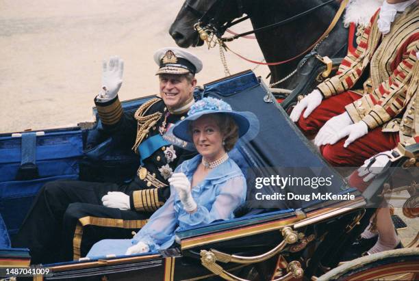 Prince Philip and Frances Shand Kydd make their way by coach to Buckingham Palace after the wedding of Prince Charles and Lady Diana Spencer, London,...