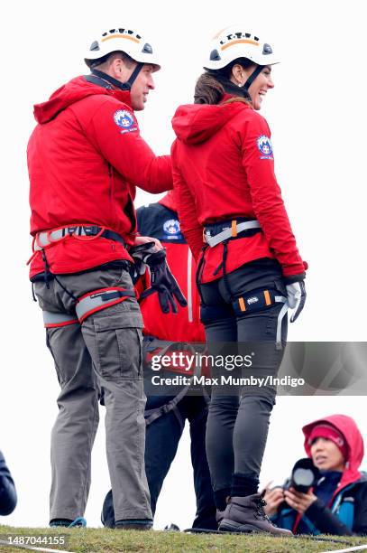 Prince William, Prince of Wales and Catherine, Princess of Wales take part in a Central Beacons Mountain Rescue Team abseiling training exercise on...