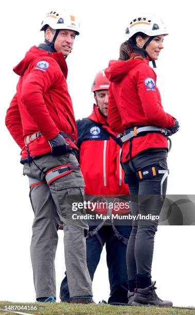 Prince William, Prince of Wales and Catherine, Princess of Wales take part in a Central Beacons Mountain Rescue Team abseiling training exercise on...