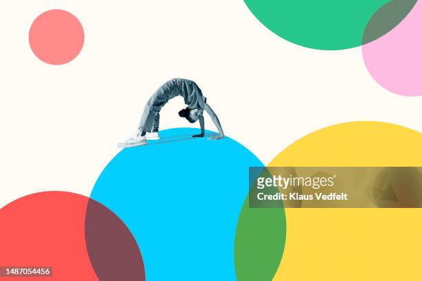 Girl bending backwards on blue circle