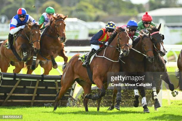 William McCarthy riding Carisbrook, Richard O'Donoghue riding Ourkhani and Will Gordon riding Tom Foolery get close in the first lap during Race 3,...