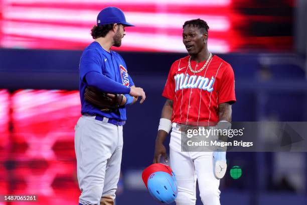 Dansby Swanson of the Chicago Cubs and Jazz Chisholm Jr. #2 of the Miami Marlins speak during the fifth inning at loanDepot park on April 29, 2023 in...