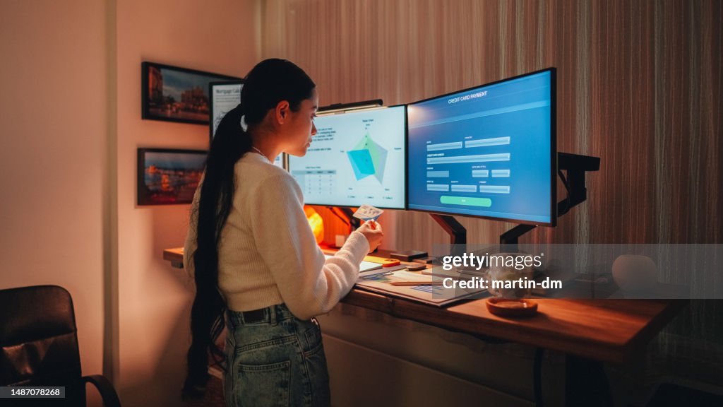 Woman working late at standing desk