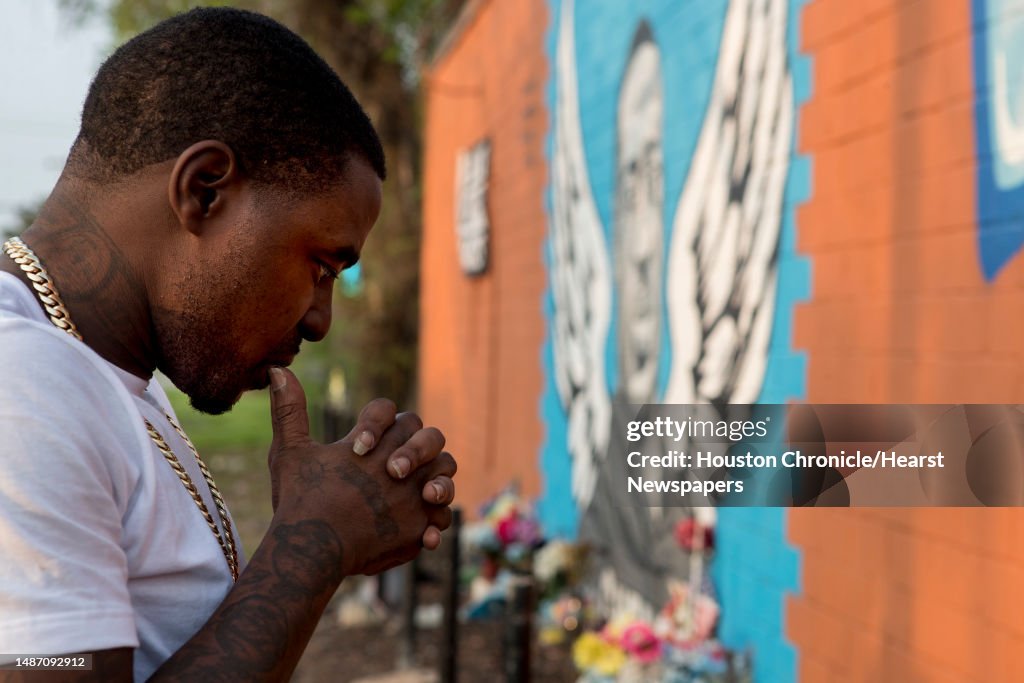 Cal Wayne Rapper Rap artist Cal Wayne pauses at the George Floyd memorial mural in 3rd ...