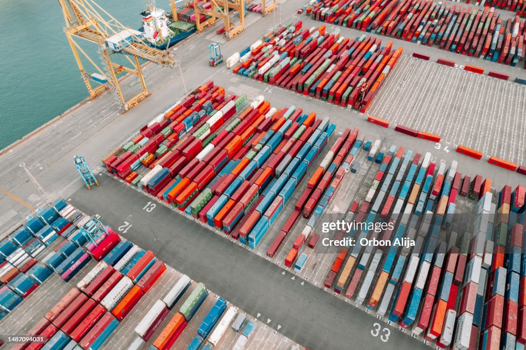 Aerial view of shipping containers in harbor