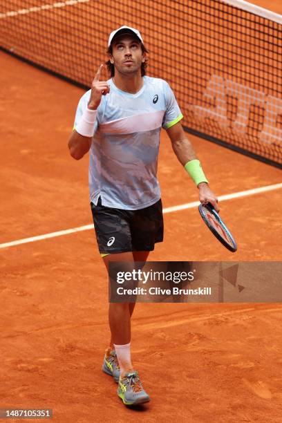 Borna Coric of Croatia gestures to the sky as they celebrate victory against Alejandro Davidovich Fokina of Spain during the Men's Singles Round Four...