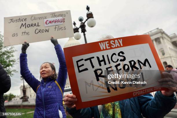 Activists attend a press conference on Supreme Court ethics reform outside of the U.S. Capitol on May 02, 2023 in Washington, DC. A group of...