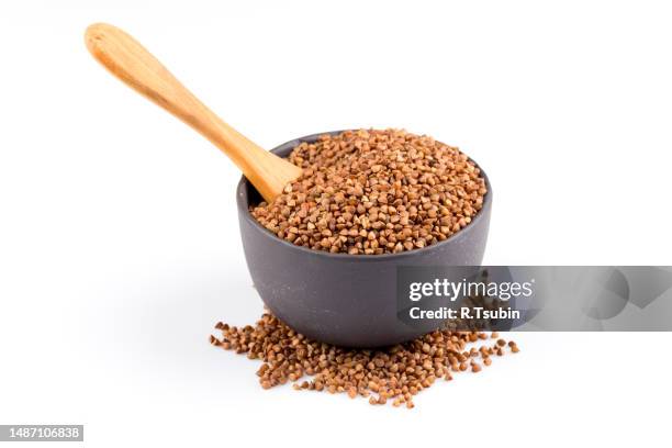 buckwheat groats in a bowl - buckwheat isolated stock pictures, royalty-free photos & images