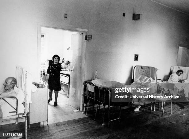 Patients in the corridors of the San Giovanni hospital, Rome, 70s.