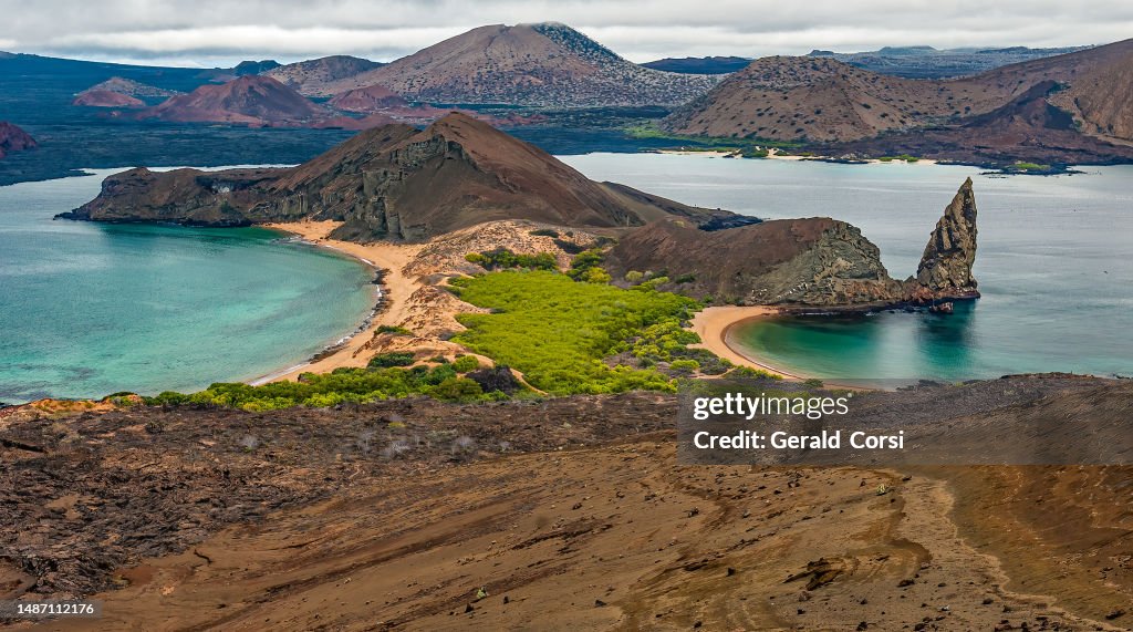 Bartolome Island, the Pinnacle Rock and the Sulivan Bay lava flow on James Island. Galapagos Islands, Ecuador.