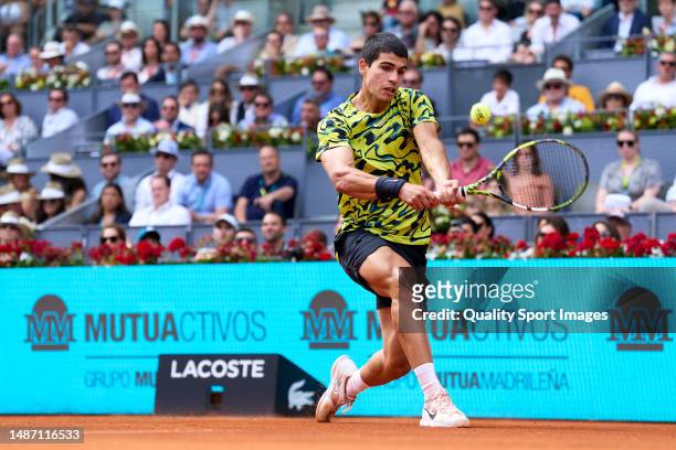 Carlos Alcaraz of Spain plays a backhand shot against Alexander Zverev of Germany during their Men's Singles fourth round match on Day Nine of the...