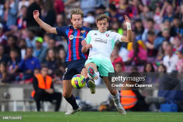 Frenkie de Jong of FC Barcelona challenges Pablo Ibanez of CA Osasuna during the LaLiga Santander match between FC Barcelona and CA Osasuna at...