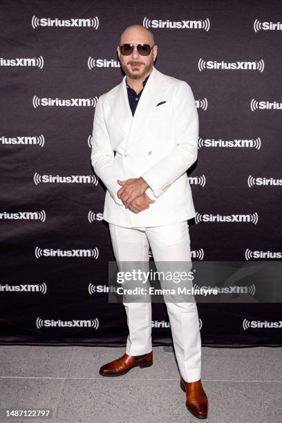 Pitbull attends Howard Stern's live broadcast from the new SiriusXM Miami Studios on May 02, 2023 in Miami Beach, Florida.