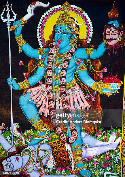 image of goddess kali stepping on her consort shiva's body as he protects the earth from her wild dance. - shiva stock-fotos und bilder