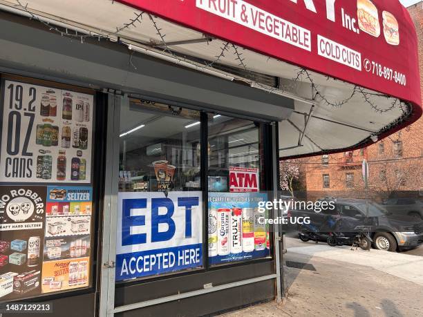 Local Bodega with EBT, Electronic Benefit Transfer, Accepted sign in window, Queens, New York.