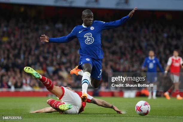 Ngolo Kante of Chelsea is tackled by Granit Xhaka of Arsenal during the Premier League match between Arsenal FC and Chelsea FC at Emirates Stadium on...