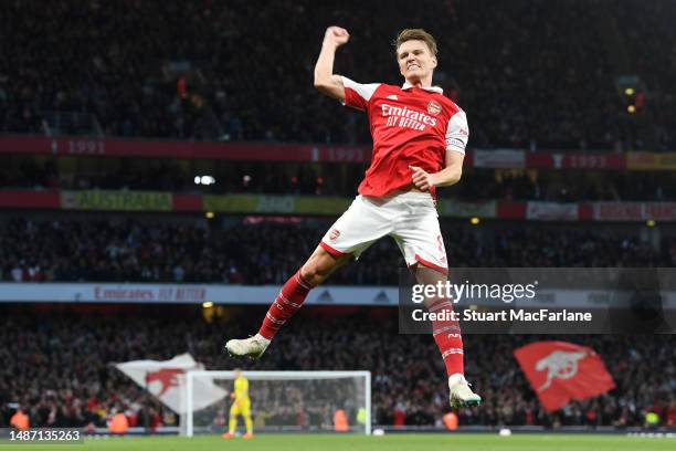 Martin Odegaard of Arsenal celebrates after scoring the team's first goal during the Premier League match between Arsenal FC and Chelsea FC at...