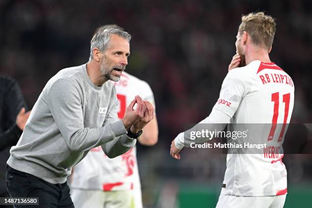 Marco Rose, Head Coach of RB Leipzig, gives instructions to Timo Werner during the DFB Cup semifinal match between Sport-Club Freiburg and RB Leipzig...