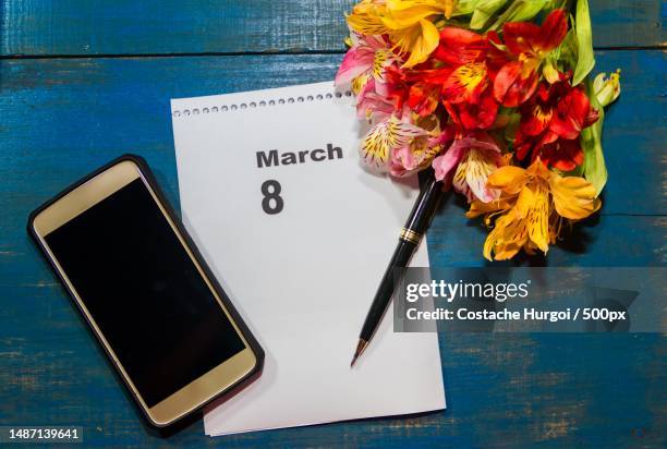 notebook and cell phone with flowers and note with place for text - international womens day 2019 stock pictures, royalty-free photos & images