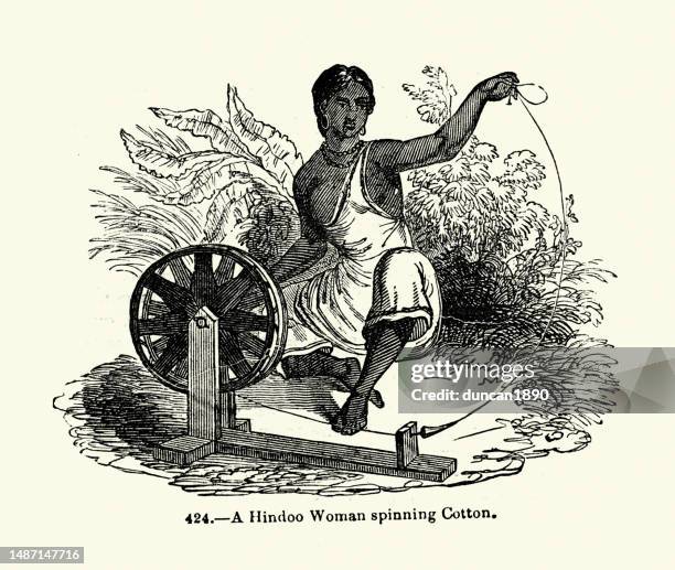 indian woman spinning cotton with a wheel, history of the textile industry, victorian 19th century, 1850s - madras indien stock illustrations