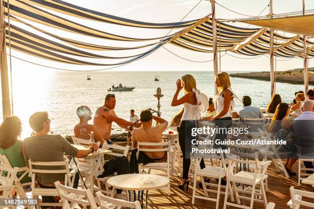 ibiza, bar along west coast at dusk - ibiza beach party stock pictures, royalty-free photos & images
