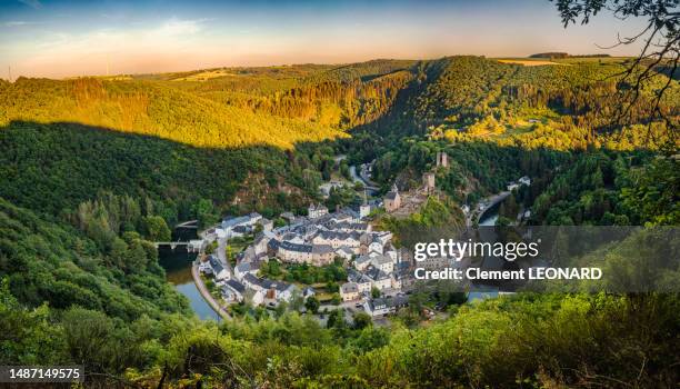 aerial view of the esch-sur-sure (esch-sauer) town, luxembourg. view of the old town, the castle ruins and the sure river from above. - luxembourg benelux stock-fotos und bilder