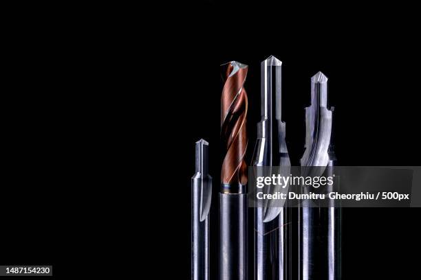 special tools isolated on dark background made to order special tools coated step drill and reamer detail hss cemented carbide carbide cutting tool for industrial applications engineering tools,romania - fräsen stock-fotos und bilder