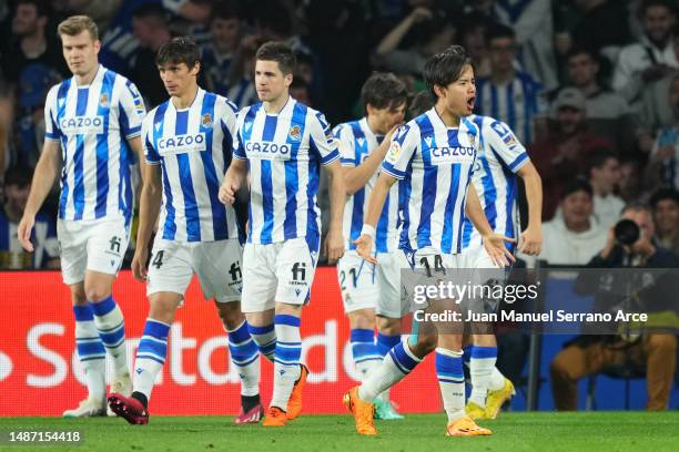 Takefusa Kubo of Real Sociedad celebrates with teammates after scoring the team's first goal during the LaLiga Santander match between Real Sociedad...