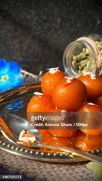 high angle view of food in container - gulab jamun stock pictures, royalty-free photos & images