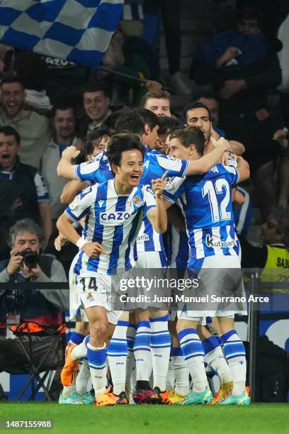 Takefusa Kubo of Real Sociedad celebrates after scoring the team's first goal during the LaLiga Santander match between Real Sociedad and Real Madrid...