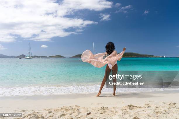 woman with beach cover up - black women in bathing suit stock pictures, royalty-free photos & images