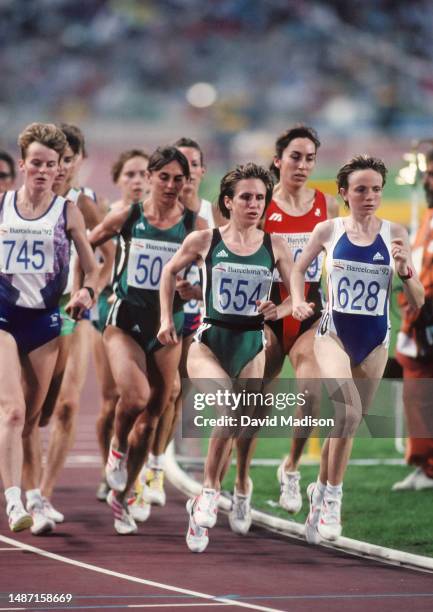 Yvonne Murray of Great Britain, eventual race winner Elena Romanova of the Unified Team, and Marie-Pierre Duros of France lead the pack during the...