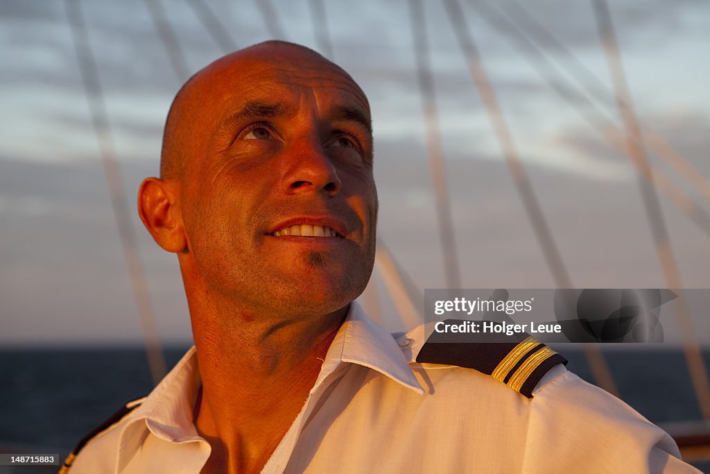 Crew member aboard sailing cruiseship Star Flyer (Star Clippers Cruises) while cruising in the Pacific Ocean.