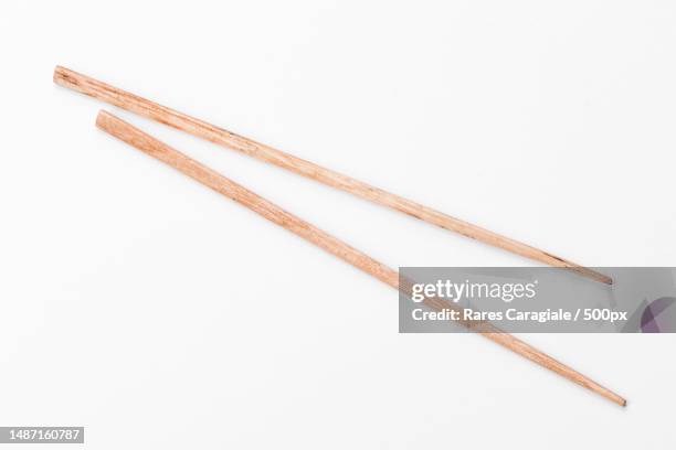 beautiful sticks for sushi isolated on a white background,romania - chopsticks stock-fotos und bilder