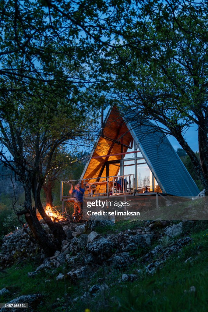 Photo of wooden cabin house during dusk