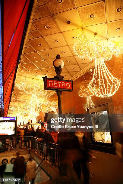 interior of galeries lafayette, decorated with christmas lights. - christmas illuminations 2012 in paris stock pictures, royalty-free photos & images