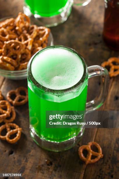 green beer in a mug for st patricks day celebration,romania - weizenbier stock-fotos und bilder