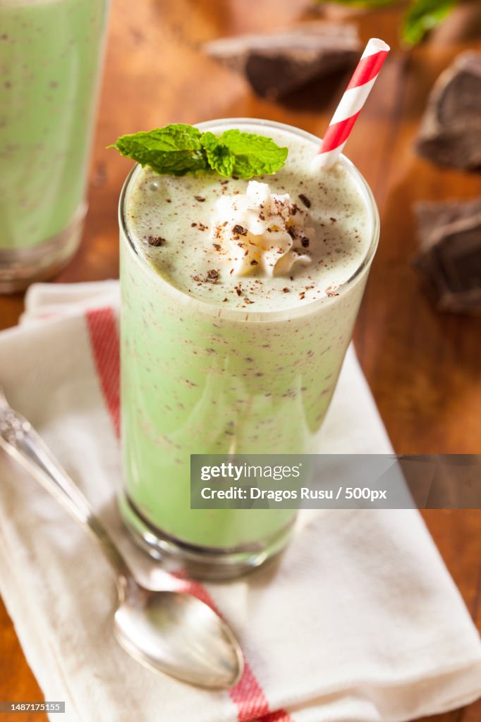 Cold Refreshing Mint Chocolate Chip Milk Shake with a Straw,Romania