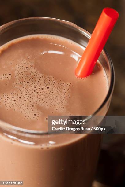 refreshing delicious chocolate milk with real cocoa,romania - chocolate milk splash stock pictures, royalty-free photos & images