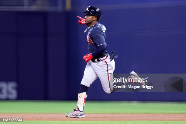 Ozzie Albies of the Atlanta Braves rounds the bases after hitting a home run against the Miami Marlins during the second inning at loanDepot park on...