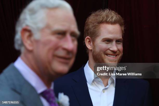 The wax figures of King Charles III and Prince Harry are seen during the unveiling of Madame Tussauds Sydney's wax figure of King Charles III on May...