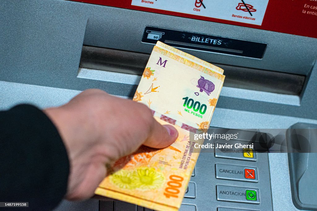 ATM. Cash machine. Argentine pesos. Cash withdrawal. Money in Argentina.