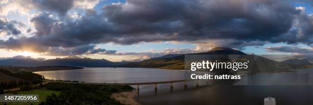 aerial shot of a bridge over a large dam at sunset - western cape province stock pictures, royalty-free photos & images
