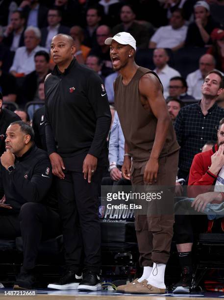 Jimmy Butler of the Miami Heat directs his teammates in the second half against the New York Knicks during game two of the Eastern Conference...