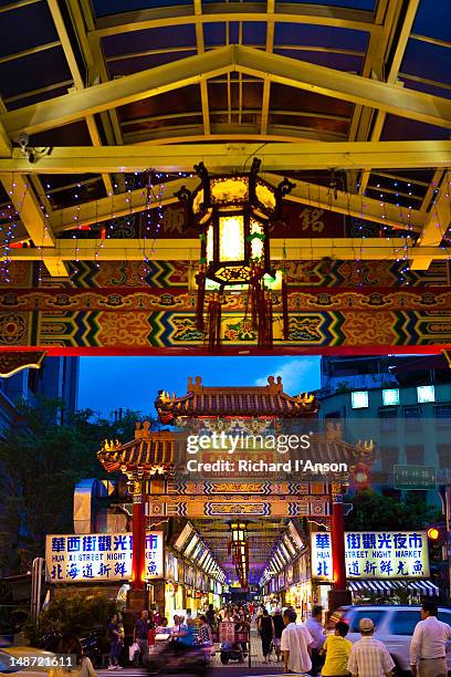 entrance to snake alley or taipei hwahsi (huaxi) tourist night market. - snake alley stock pictures, royalty-free photos & images
